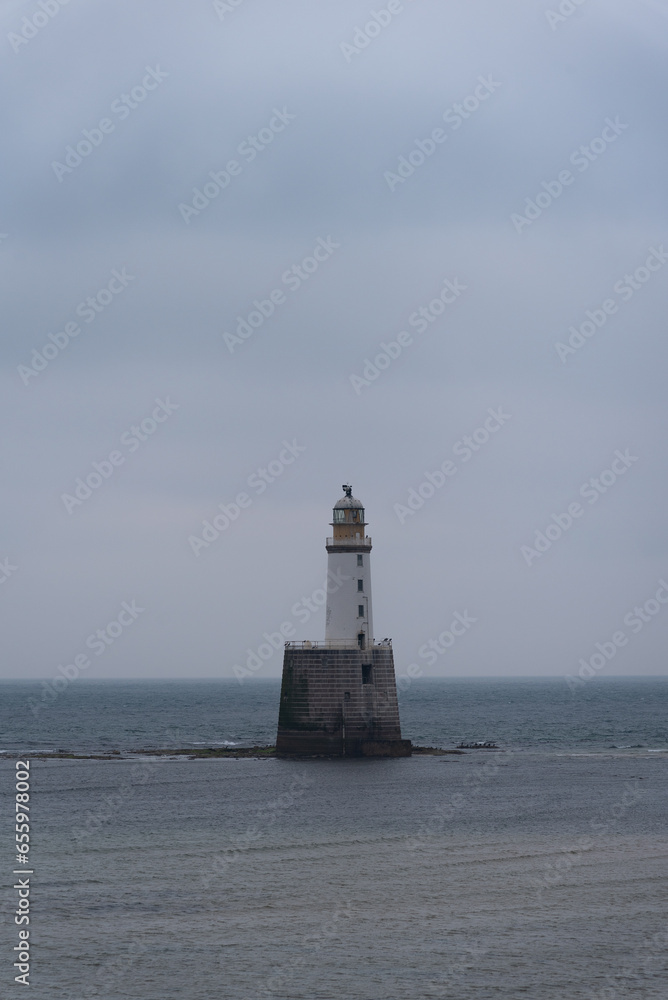 Rattray Head lighthouse in scottish highlands. North coast 500. Calm coastline with nobody. Rattray Head lighthouse in scottish highlands. North coast 500. Calm coastline with nobody.