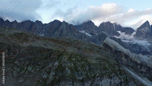 Aerial drone view of majestic Switzerland Alps with huge glaciers. Steep rocky peaks of Piz Bernina mountain range