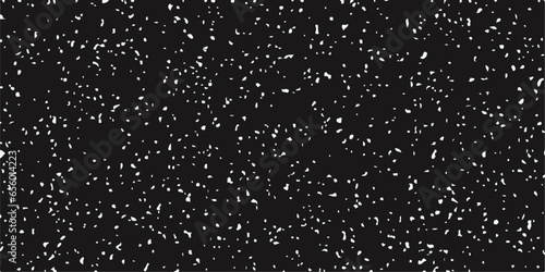 adobe abstract Chaotic white bokeh on a black background.Cloud of white snowflakes floating in the air.White snowflakes falling in slow motion against an isolated black background.