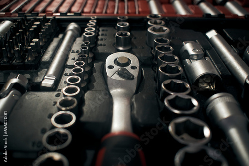 Ratchet and wrench socket in toolkit photo