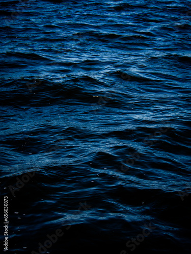 Fototapeta Naklejka Na Ścianę i Meble -  Dark blue water surface.