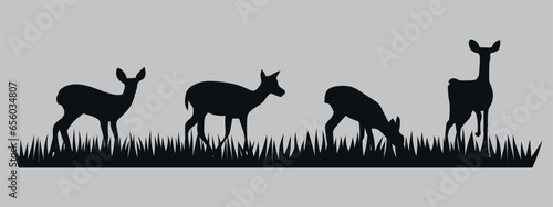 Young deer grazing on grass. Black silhouette. Vector on gray background.