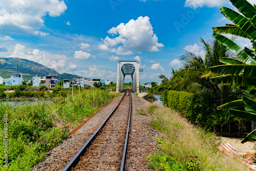 Railway bridge over the river. The old railway in the city of Nha Trang in Vietnam.