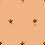 green leaves seamless pattern on beige background