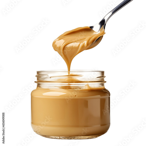 Creamy Peanut Butter Spreading into a Jar Isolated on White Background
