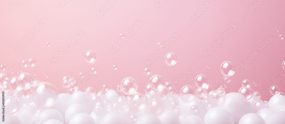 Pink pastel background with white foam bubbles perfect for laundry and cleaning services