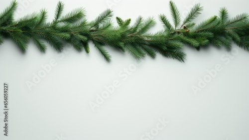 a minimalist composition of green pine branches and a delicate garland  the natural beauty of the branches and gentle lighting.