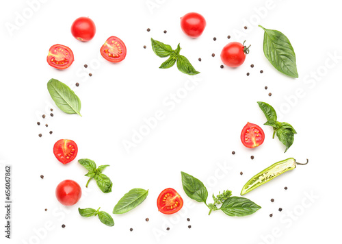Fototapeta Naklejka Na Ścianę i Meble -  Frame made of fresh basil, cherry tomatoes and peppercorn on white background