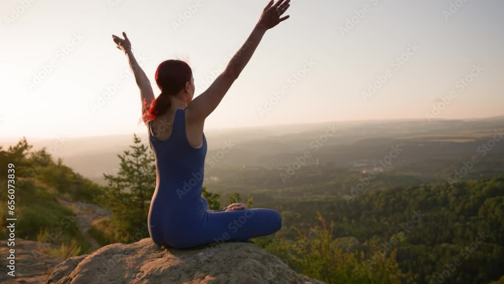 Yoga Session in the Mountains. Young Athletic Woman Exercising in the Rocky Mountains During Sunrise, Doing Various Yoga Poses - Healthy Lifestyle and Zenism Concept. Slow Motion. Yoga Session in the Mountains. Young Athletic Woman Exercising in the Rocky Mountains During Sunrise, Doing Various Yoga Poses - Healthy Lifestyle and Zenism Concept. Slow Motion.