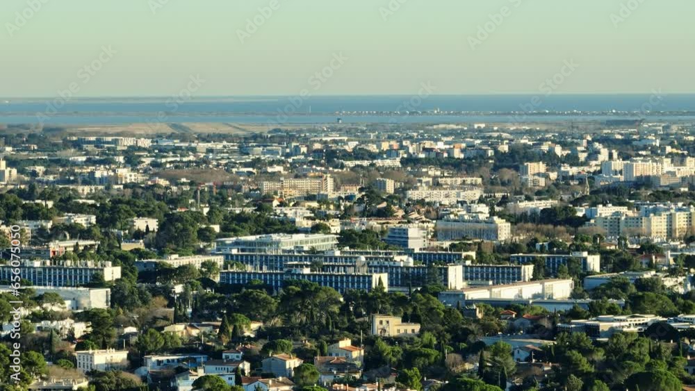 Montpellier from above: a harmonious blend of urban structures and verdant Montpellier from above: a harmonious blend of urban structures and verdant