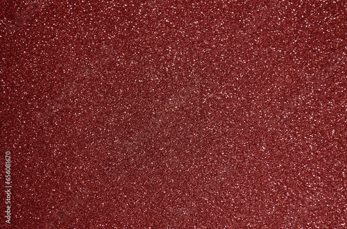 Fondo de brillos / textura glitter de color rojo. Se puede usar como fondo de año nuevo