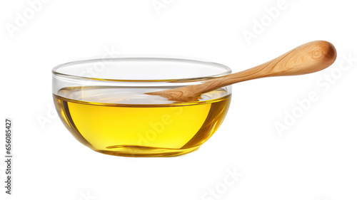 Vegetable cooking oil in glass bowl with wooden spoon isolated on transparent or white background