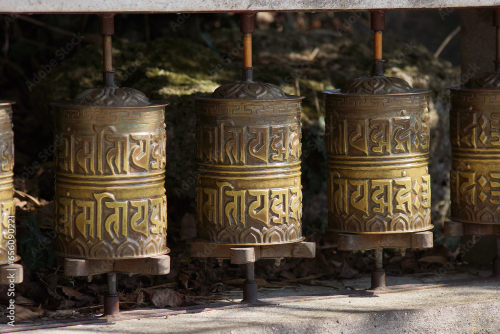 buddhist tibetan prayer wheels in the sunlight buddhist tibetan prayer wheels in the sunlight
