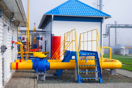 Gas distribution station. View of territory of gas distribution station with pipes and containers. Industrial facility of Gazprom company. Transportation of natural gas through pipes. Background.