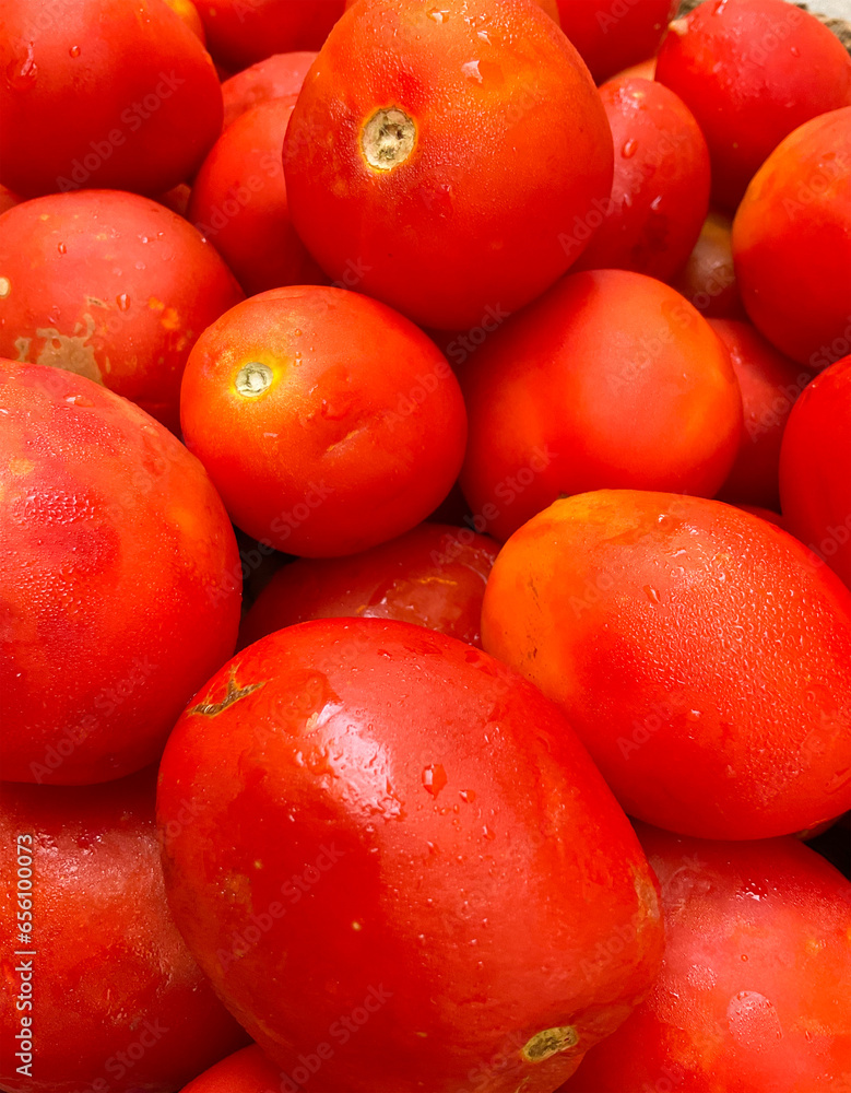 Top View of Tomato Laying on Surface - Water Drops on Tomato Top View of Tomato Laying on Surface - Water Drops on Tomato