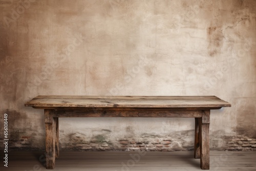 Shabby Old Wooden Table in front of an old wall © Moonpie