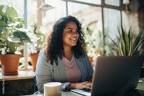 stylish plus size woman working on laptop,a radiant smile,she effortlessly multitasks on her laptop.