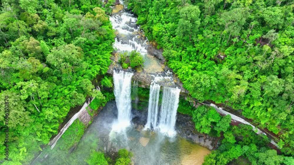 Discover a cascading waterfall hidden amidst a thriving tropical jungle. A mesmerizing fusion of water and wilderness. Huai Luang Waterfall, Thailand. Dream destinations concept. Bird's eye view.
Discover a cascading waterfall hidden amidst a thriving tropical jungle. A mesmerizing fusion of water and wilderness. Huai Luang Waterfall, Thailand. Dream destinations concept. Bird's eye view.