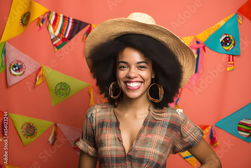 Portrait of a beautiful young brazilian woman wearing a straw hat. festa junina, festival concept photo