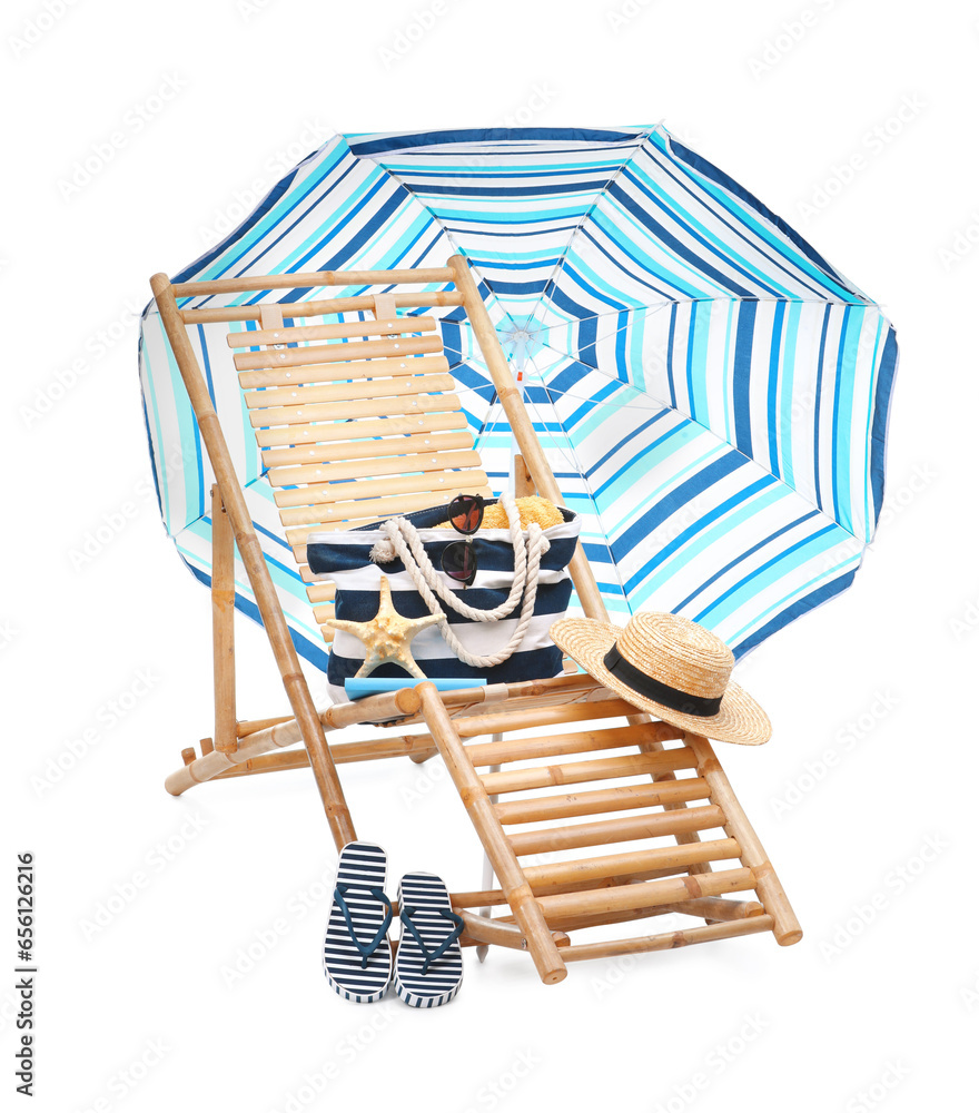 Deck chair, umbrella and other beach accessories isolated on white