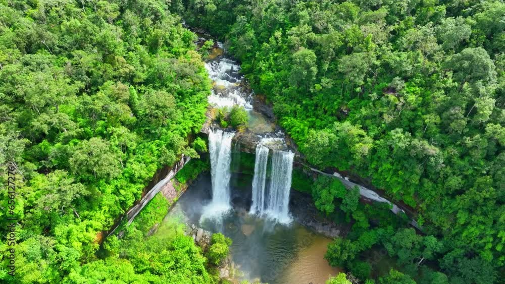 Nature's Majesty: An awe-inspiring waterfall, a jewel of the tropical forest. Its beauty captivates the soul, a serene oasis in the heart of nature. Phu Chong Na Yoi national park, Thailand. Drone.
Nature's Majesty: An awe-inspiring waterfall, a jewel of the tropical forest. Its beauty captivates the soul, a serene oasis in the heart of nature. Phu Chong Na Yoi national park, Thailand. Drone.