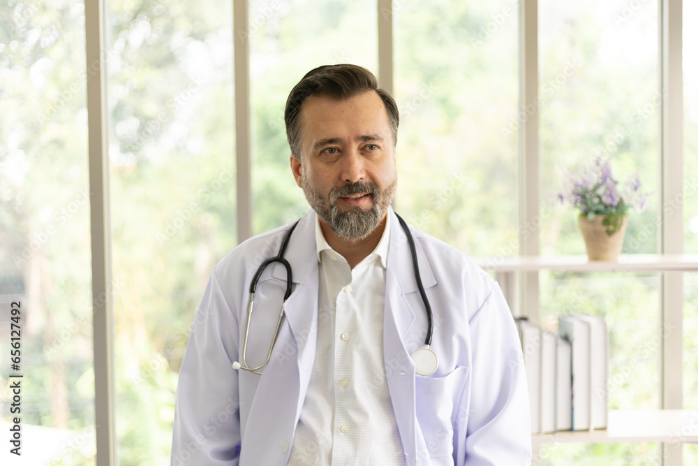 Caucasian physician portrait. Doctor with stethoscope portrait in uniform at hospital. Healthcare and medicine concept. Caucasian physician portrait. Doctor with stethoscope portrait in uniform at hospital. Healthcare and medicine concept.