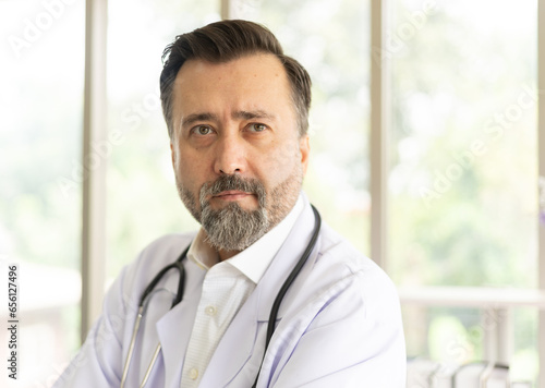 Caucasian physician portrait. Doctor with stethoscope portrait in uniform at hospital. Healthcare and medicine concept.