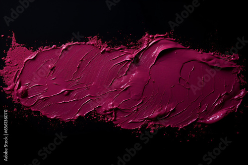 Pink lipstick smudges on a black background with a black background