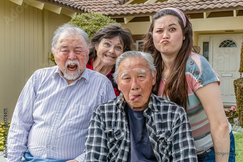 Four family members making faces at the camera, horizontal