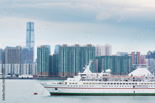 Cruise ship in harbor and skyline of Hong Kong city