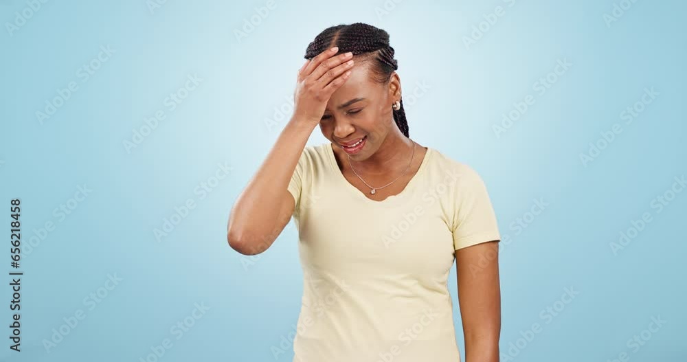 Stress, doubt and black woman in a studio with fear, scared or angry facial expression in crisis. Anxiety, mad and fail of young African female model with panic face isolated by blue background. Stress, doubt and black woman in a studio with fear, scared or angry facial expression in crisis. Anxiety, mad and fail of young African female model with panic face isolated by blue background.