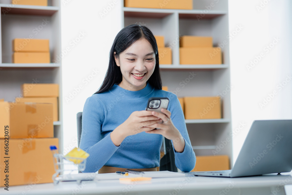 small business entrepreneur Happy independent Asian woman smiling Young successful Asian woman Packaging, online marketing and shipping ideas small business entrepreneur Happy independent Asian woman smiling Young successful Asian woman Packaging, online marketing and shipping ideas