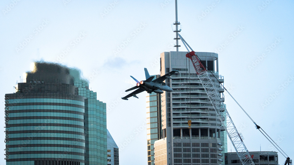 Fototapeta premium Millitary airplane over city