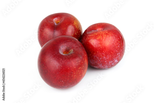 Three red plums isolated on white background © Valerii Evlakhov