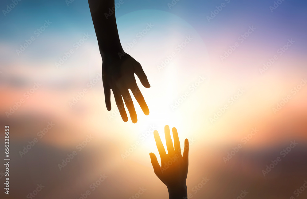 Silhouette of giving a helping hand over sunset background. Silhouette of giving a helping hand over sunset background.