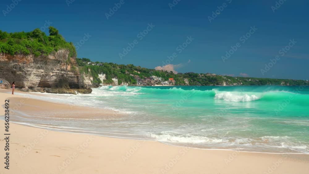 Dreamland Bali beach with silhouette surfer and travel people on tropical beach Bali Indonesia 4K Dreamland Bali beach with silhouette surfer and travel people on tropical beach Bali Indonesia 4K