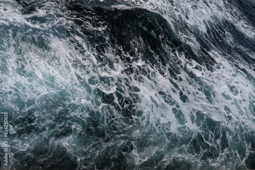 white sea foam on dark blue sea, splash, waves of the ocean © Anastasiya