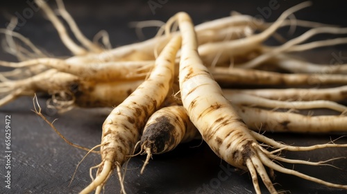 Raw salsify roots on table closeup view  photo