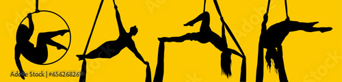 Pretty woman - aerialist doing acrobatic tricks on aerial silks