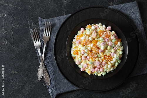 Ambrosia Salad in black bowl, top view