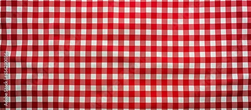 Top view background for a food advertisement featuring a red checked picnic cloth and green grass