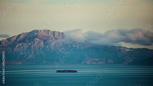 Container ships crossing the Strait of Gibraltar along the coast of Morocco - time lapse