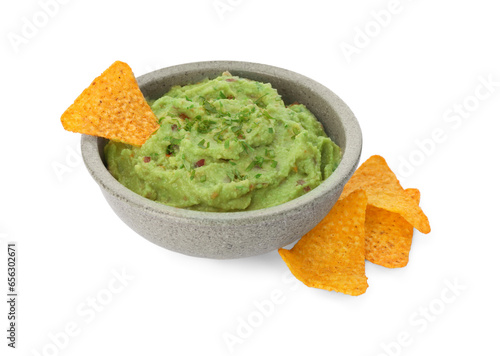 Bowl of delicious guacamole and nachos chips isolated on white