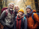 Portrait of smiling group friends hiking in autumn forest, active lifestyle, ecotourism. 