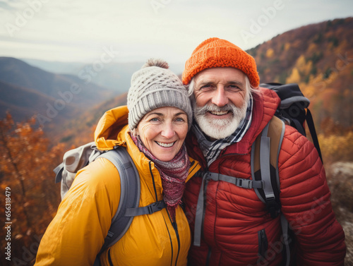 Portrait of  senior couple hiking at mountains  walking at nature  enjoying  active lifestyle  eco tourism.