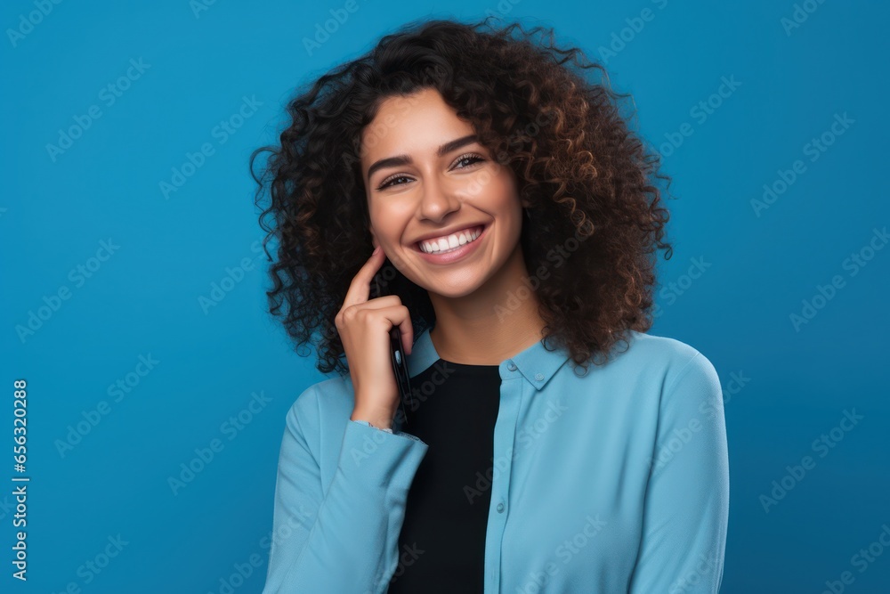 Young beautiful woman wearing business suit over isolated background doing happy thumbs up gesture with hand. Approving expression looking at the camera showing success. Young beautiful woman wearing business suit over isolated background doing happy thumbs up gesture with hand. Approving expression looking at the camera showing success.