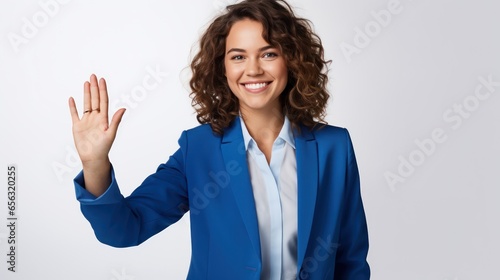 Young beautiful woman wearing business suit over isolated background doing happy thumbs up gesture with hand. Approving expression looking at the camera showing success.