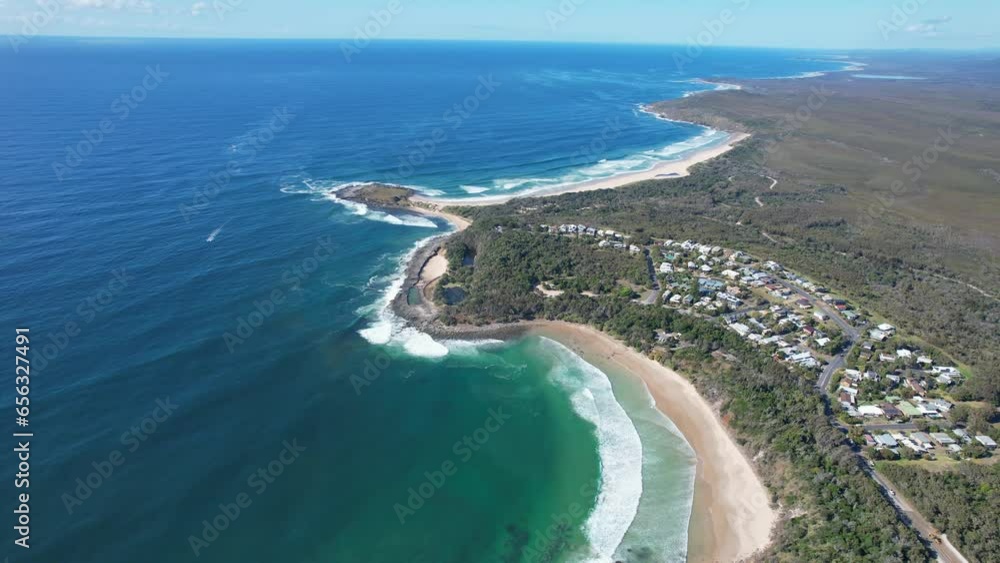 Aerial Pullback Reveal Of Spooky Beach Near Angourie Point Beach In NSW, Australia.