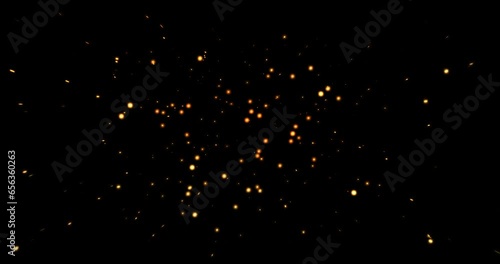 gold glow particles bokeh sparkle glittering on black background, holiday christmas new year celebration