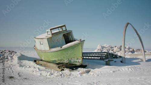 Winterized boat on snowy beach at Utqiagvik Barrow Alaska North Slope in the Arctic photo